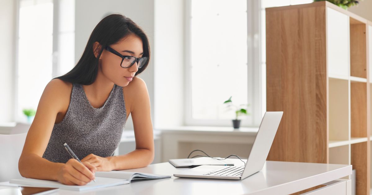 image of lady studying to understand how credit scores are calculated 